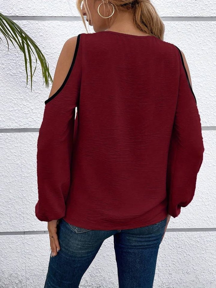 Kvinnlig topp med aprikos/burgund färgblock, fyrkantig hals. Långärmad blus, modern stil.