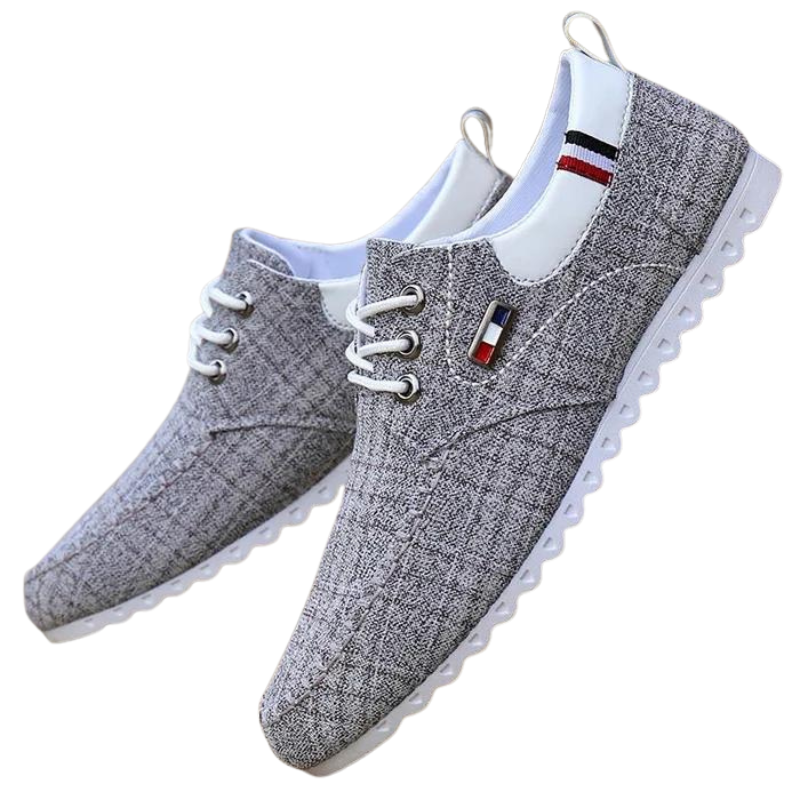 Grå slip-on sneakers för herrar, bekväma vardagsskor med enkel stil.