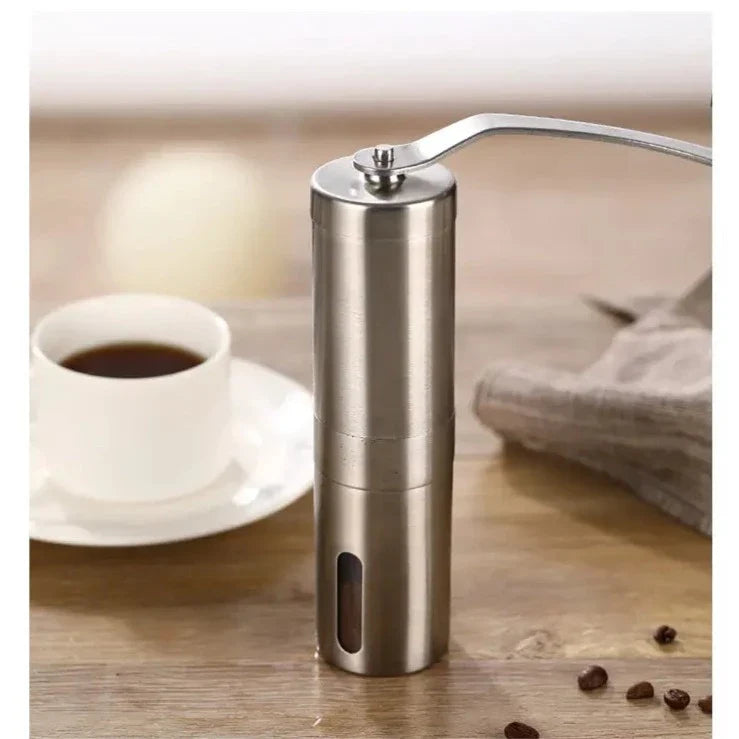 Bärbar manuell kaffekvarn i rostfritt stål, elegant design, perfekt för resekaffe och kaffeälskare.