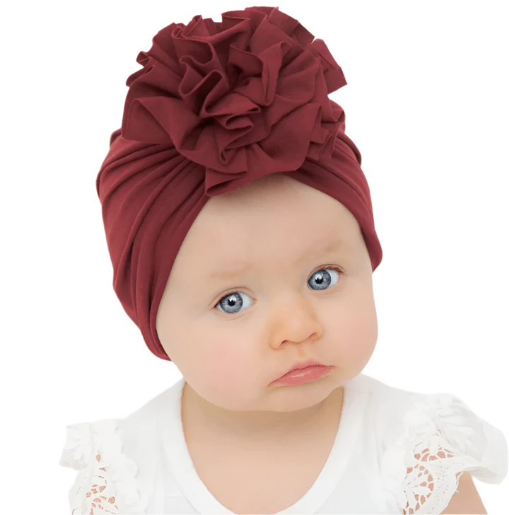 Babymössa: Mjuk turbanmössa i bomull med charmig volangtopp för nyfödd, perfekt babytillbehör.
