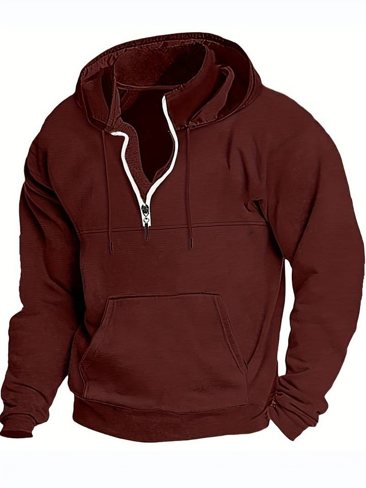 Närbild på mjukt tyg i en bekväm herrhoodie, perfekt för vardagsstil, fritid och höst.