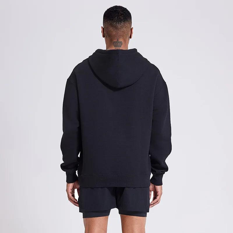 Snygg herrhoodie bakifrån, med bekväm passform. Unisex-tröja för alla dagar.
