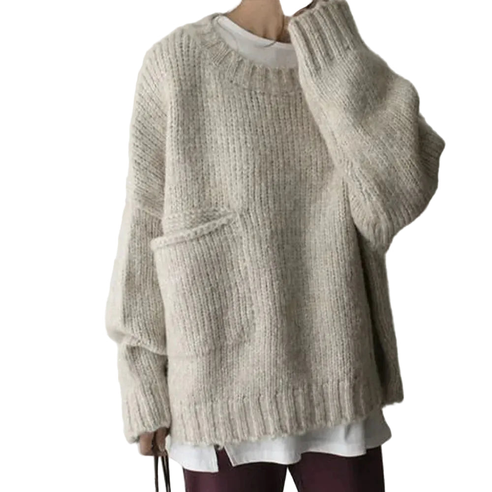 Bekväm oversize damtröja med långa ärmar och praktisk framficka. Mjuk och avslappnad för vardagsbruk.