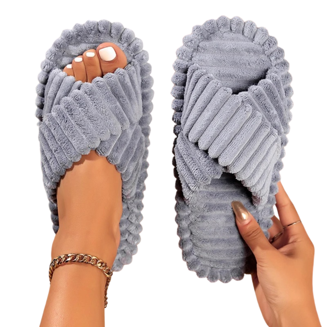 Bekväma damtofflor i manchestertyg med eleganta korsband, idealiska för avkoppling hemma.