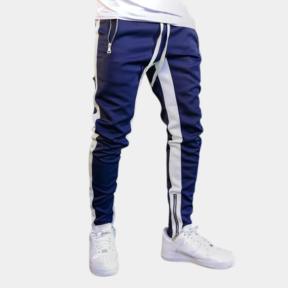Blåa joggingbyxor för män med trendig design, elastisk midja och praktiska sidofickor.