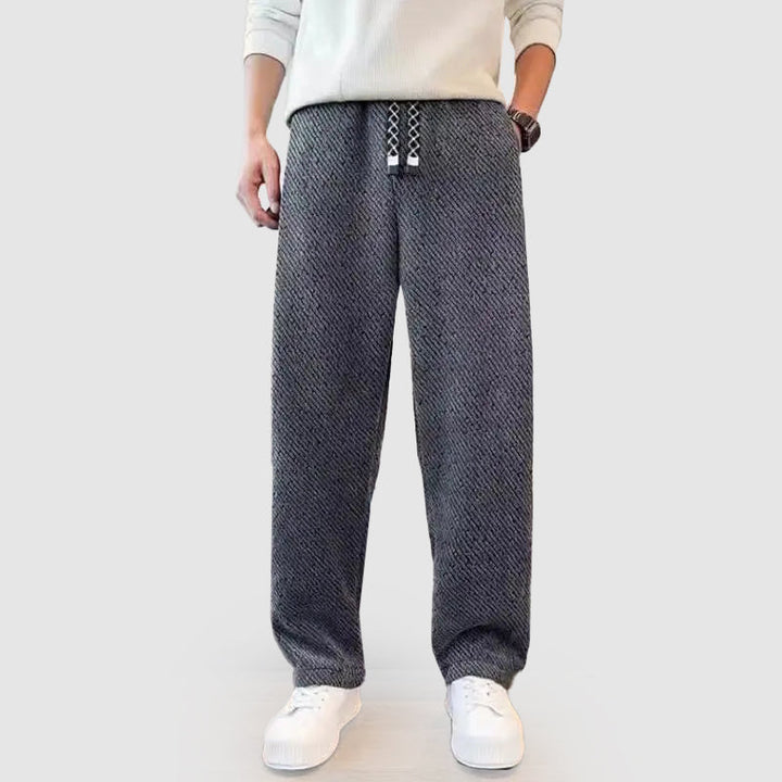 Mångsidiga herrbyxor med vida ben och dragsko i midjan. Perfekta avslappnade byxor.