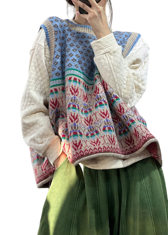 Blå oversized stickad damväst för en trendig lager på lager-look. Bekväm och ärmlös, perfekt vår/höstmode.