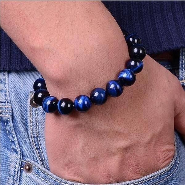 Skyddande unisex armband i blått tigeröga. Kraftfullt energismycke för att öka lugnet & minska stress.