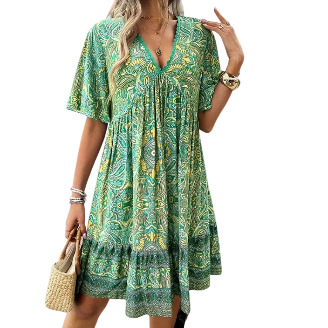 Boho miniklänning för kvinnor med lekfullt paisleymönster. Perfekt sommarklänning för festival eller semester, färgglad och avslappnad.