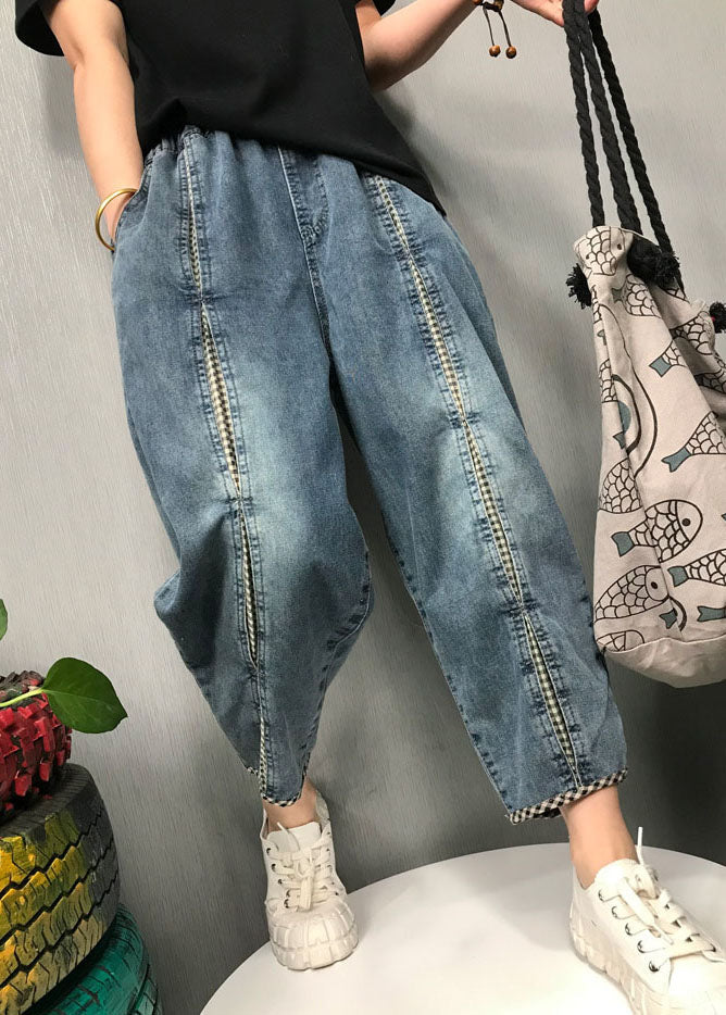 Kvinnors avslappnade patchwork jeans med bohemisk stil, bekväm resår i midjan och mönstrad design.