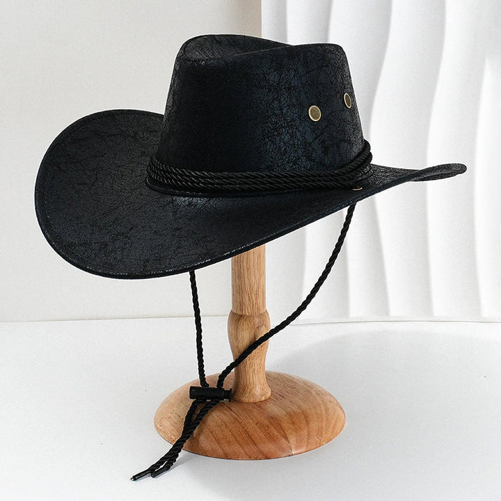Stilren brun herrhatt i cowboymodell, tidlös westernstil med brett brätte. En mångsidig accessoar.