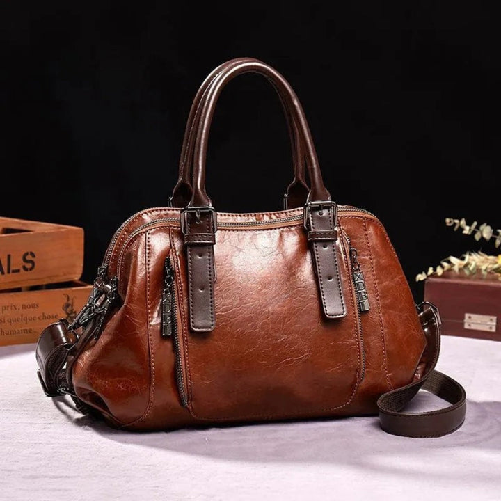 Rymlig chic vintage handväska för kvinnor. Elegant damväska med smart förvaring, perfekt vardagsaccessoar.