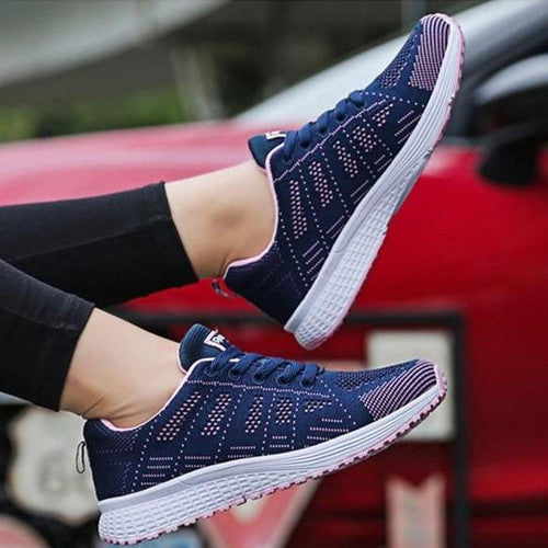 Dam andningsaktiva fritidssneakers i elegant grå nyans, mångsidiga för olika tillfällen.
