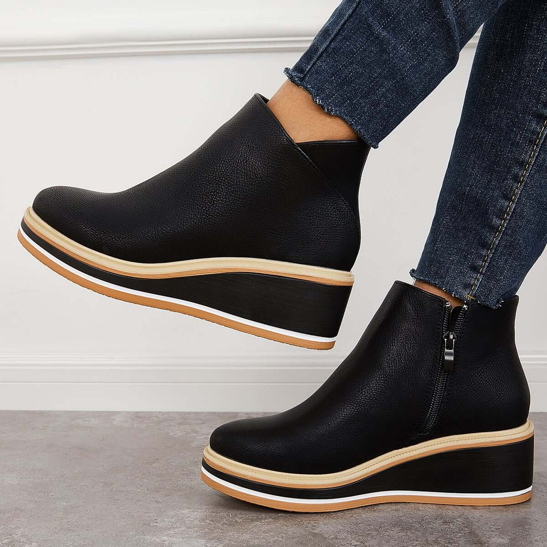 Svarta ankelhöga platåstövlar för dam, med praktisk dragkedja. Perfekta eleganta vardagsstövlar.