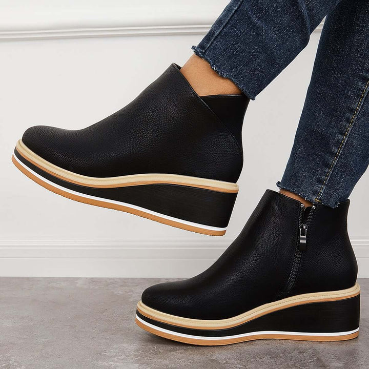 Svarta ankelhöga platåstövlar för dam, med praktisk dragkedja. Perfekta eleganta vardagsstövlar.
