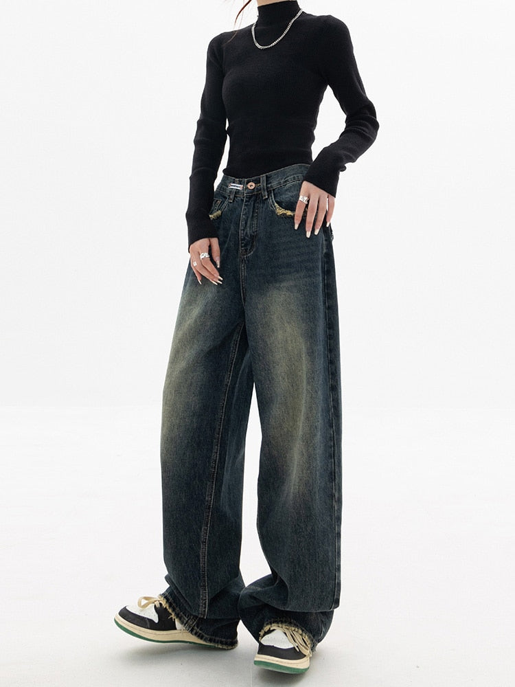 Vintage-inspirerade blå damjeans med lös passform och hög midja, perfekta för vardagsbruk.
