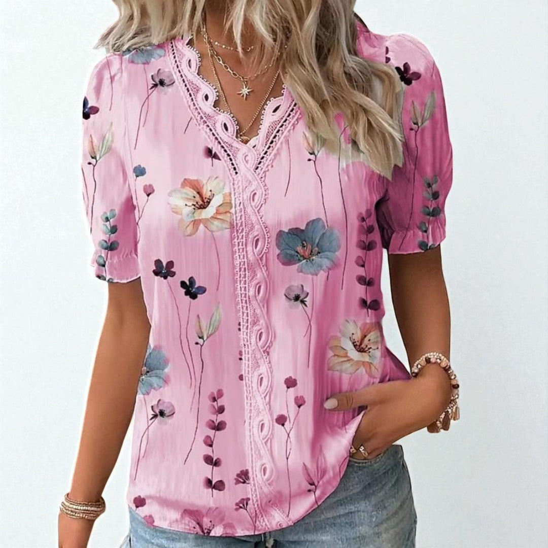 Mångsidig dam blus i bomull med blommigt tryck, bekväm för både vardag och fest, en feminin blus.