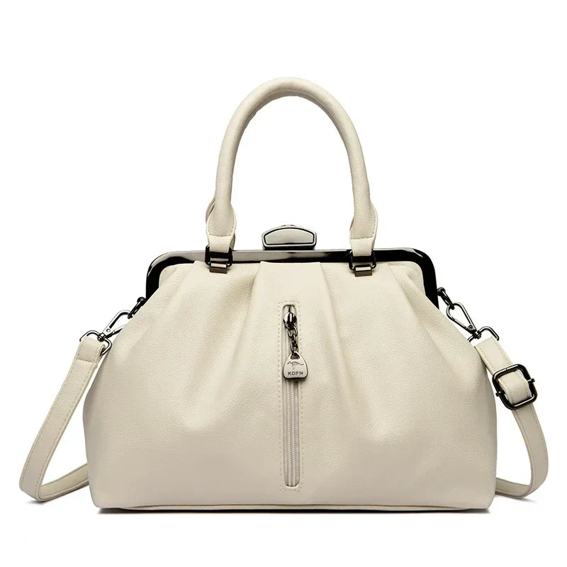 Dam crossbody väska i PU-läder. Trendig, rymlig och justerbar axelrem för elegant vardag.