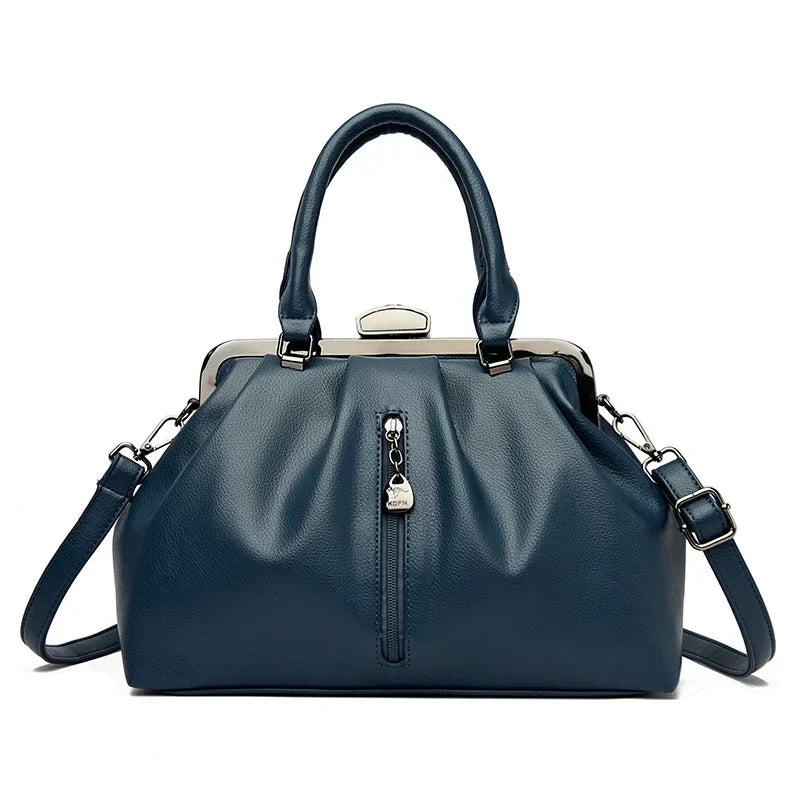 Slitstark PU-läder väska. Trendig crossbody damväska med rymlig insida och justerbar axelrem.