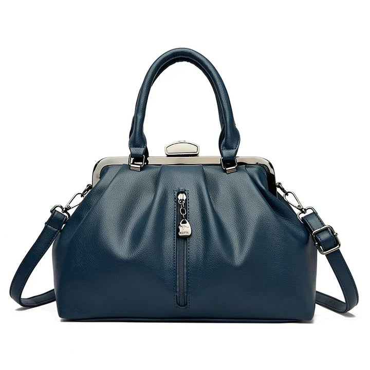 Slitstark PU-läder väska. Trendig crossbody damväska med rymlig insida och justerbar axelrem.