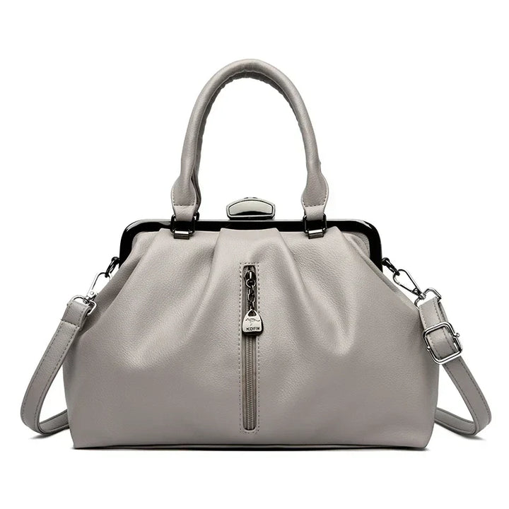 Damaccessoar: Stilren crossbody väska i PU-läder. Rymlig, justerbar axelrem, elegant design.