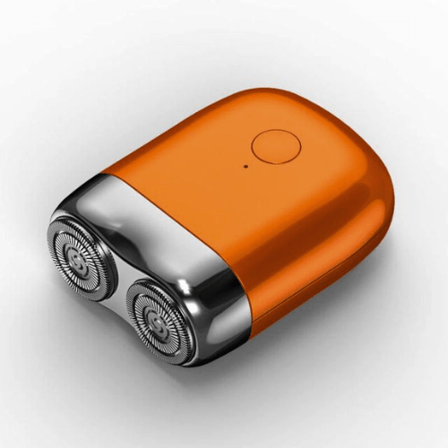 Elegant vit/rosa mini elektrisk rakapparat för dam. Designad för effektiv och skonsam personlig vård.