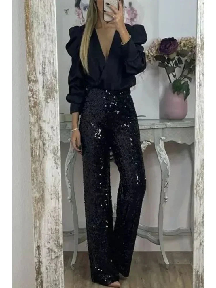 Glamorösa dam festbyxor med helglittrande paljetter. En elegant look för kvinnor på varje party.