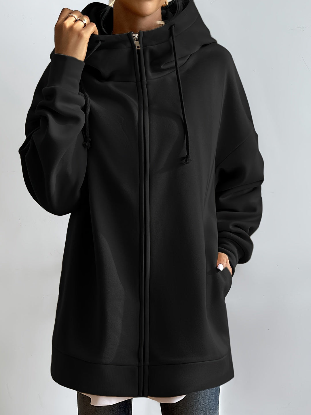 Dam hoodie med dragkedja i mjukt tyg, perfekt för sport och vardag.