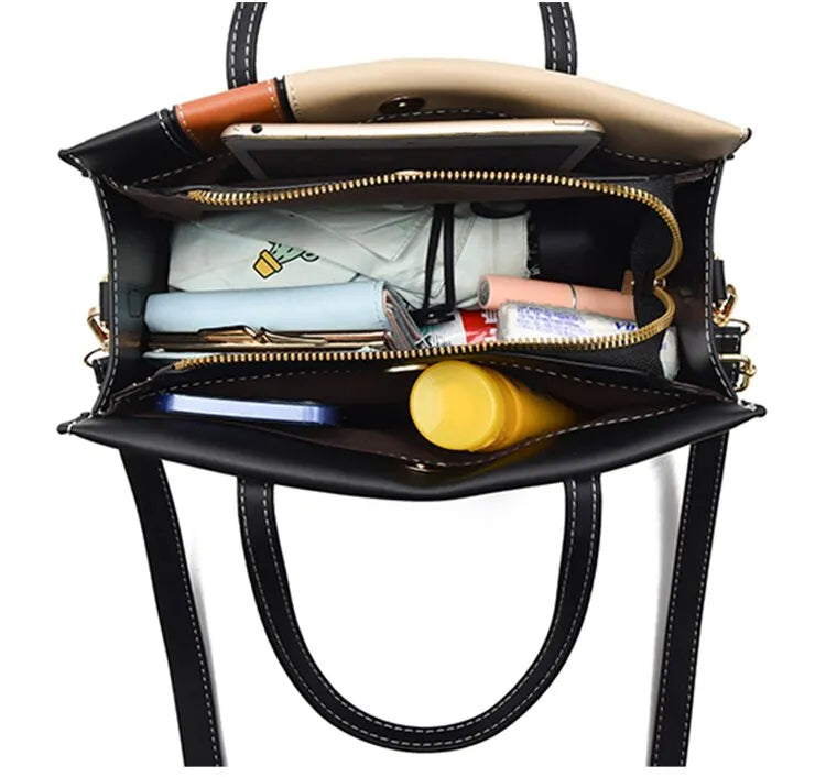Fashionabel patchwork handväska för dam. Kan användas som axelväska eller crossbody. Stilren accessoar.