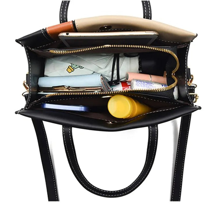 Fashionabel patchwork handväska för dam. Kan användas som axelväska eller crossbody. Stilren accessoar.
