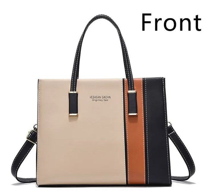 Modern damväska med patchwork, perfekt som axelväska eller crossbody. En elegant modeaccessoar.