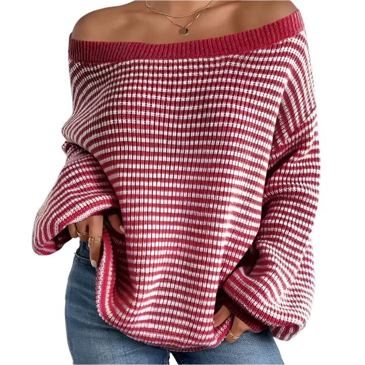 Dam stickad oversized tröja med trendiga lanternärmar. Bekväm vardagströja med drop-shoulder passform.