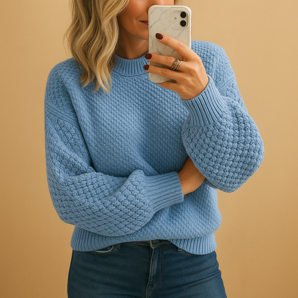 Mysig damtröja med stickad textur, perfekt för vintervärme. Denna långärmade tröja ger en bekväm vardagslook.