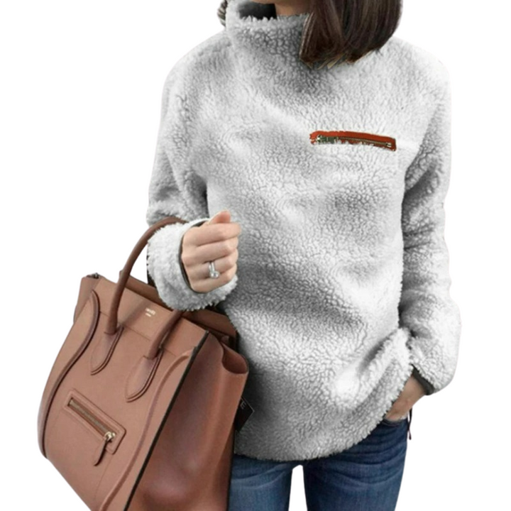 Mysig, sköldpaddshalsad damtröja. Enfärgad pullover i mjukt material, idealisk för kalla dagar.