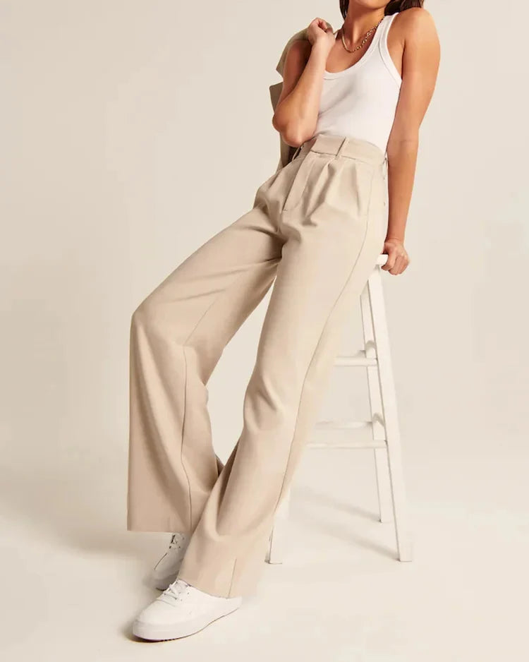 Bruna dambyxor med hög midja och vida ben. Ger en elegant look för både vardag och fest.