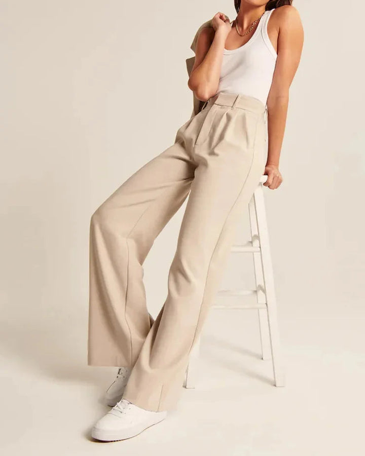 Bruna dambyxor med hög midja och vida ben. Ger en elegant look för både vardag och fest.