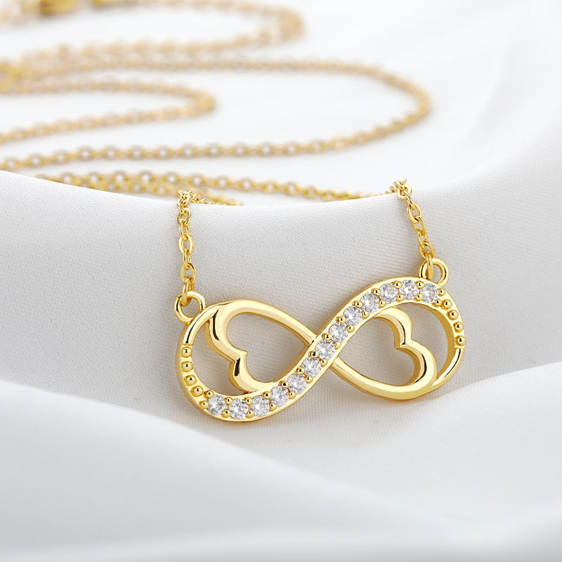Guldpläterat oändlighetshalsband för dam, evig kärlek och tidlös design. Perfekt present.