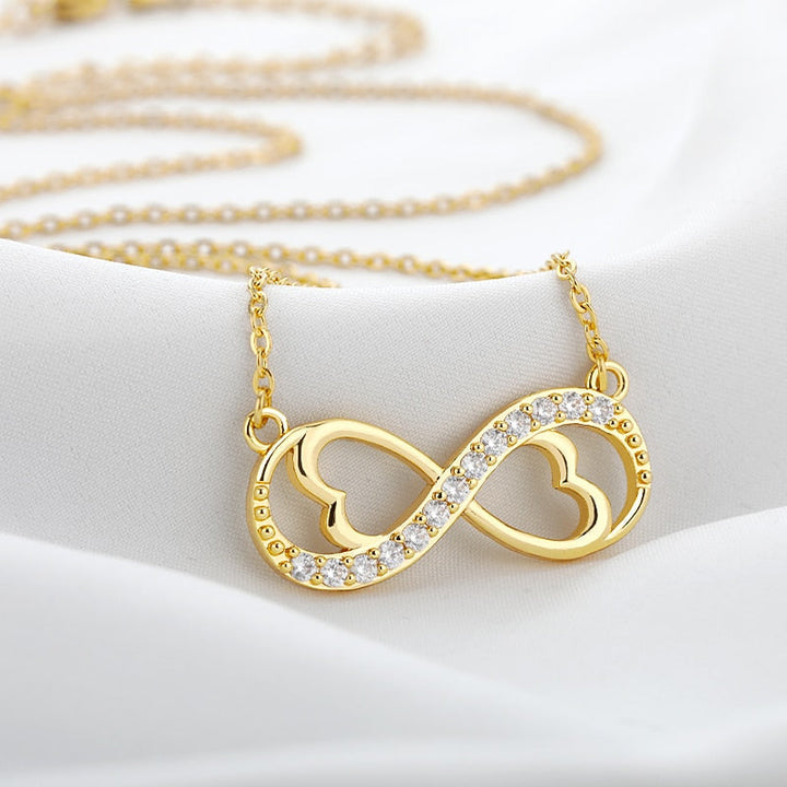 Guldpläterat oändlighetshalsband för dam, evig kärlek och tidlös design. Perfekt present.