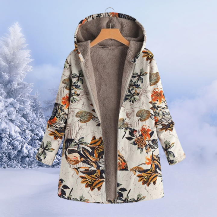 Modern damjacka i stilren medellång design. Långärmad för ökad värme. Perfekt ytterplagg.