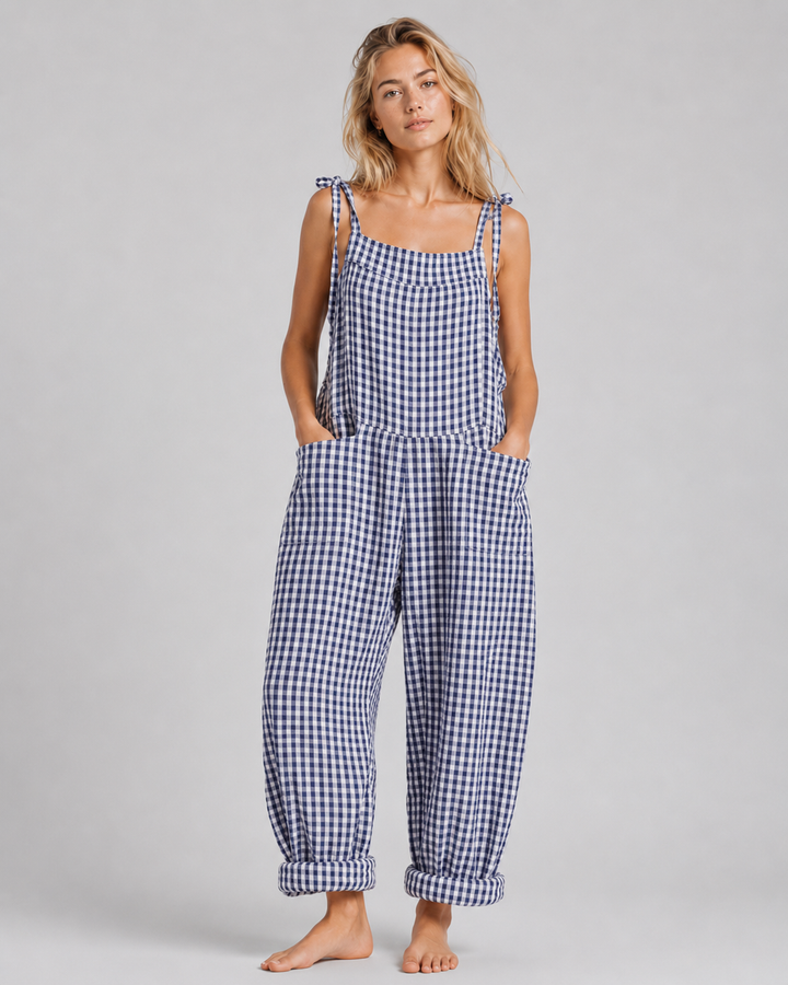 Somrig damjumpsuit med lös passform. Lätt & luftig byxdress för bekväm elegant stil.