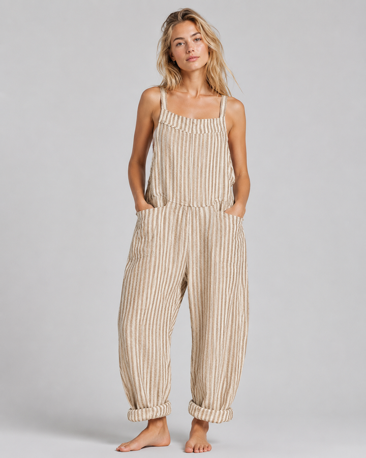 Modell bär elegant byxdress på fest. Lös passform kombinerar komfort med stil.