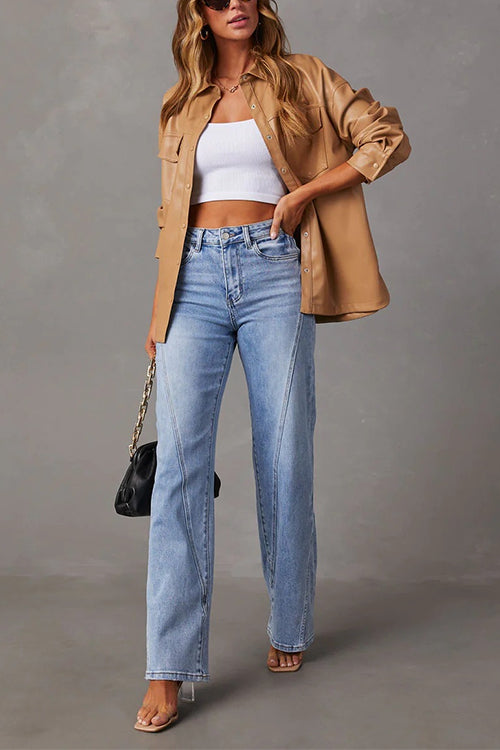 Höst- och vårmode: Raka jeans för dam med moderna slitna detaljer.