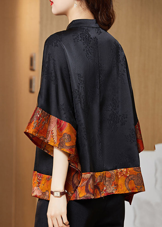 Sommarfärdig damskjorta med batwing ärmar, asymmetrisk design, vintage look