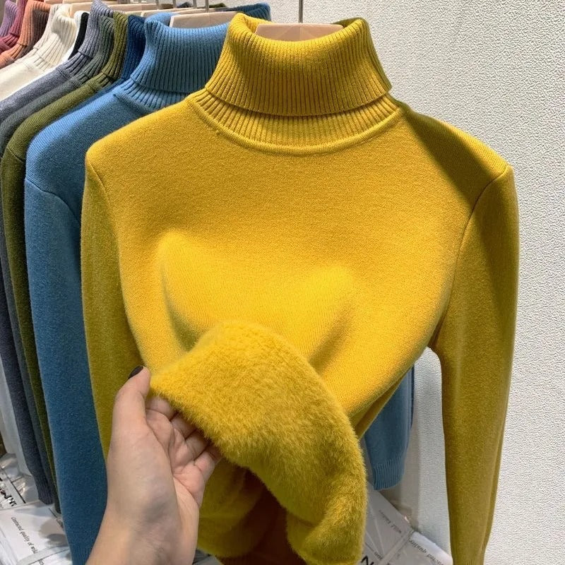 Mysig damtröja med sköldpaddshals i tidlös design, perfekt för casual vinteroutfits.