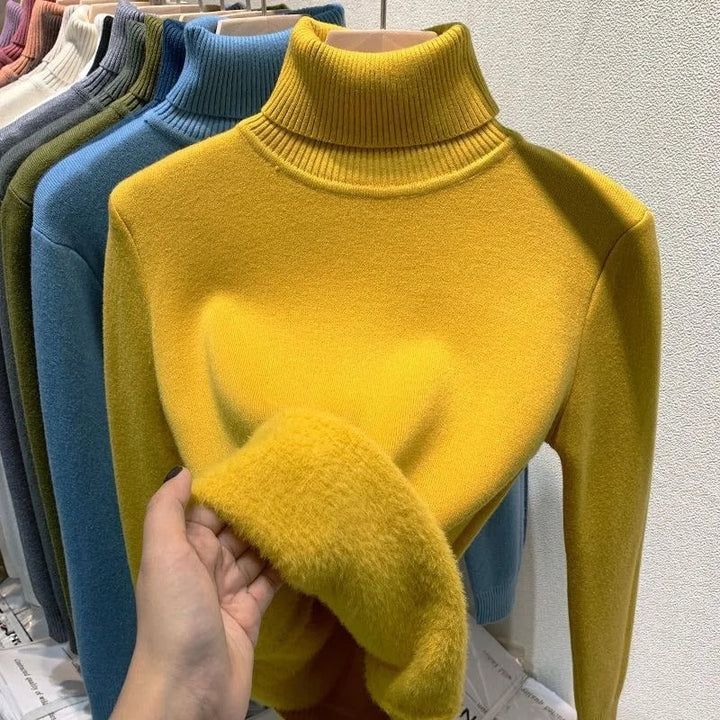 Mysig damtröja med sköldpaddshals i tidlös design, perfekt för casual vinteroutfits.