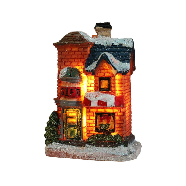 Detaljerat julbyhus med LED-belysning, perfekt för att skapa en magisk julscen och vinterunderland.