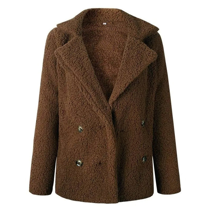 Brun dubbelknäppt nallejacka, oversized damjacka, stilren och varm för höstens mode.