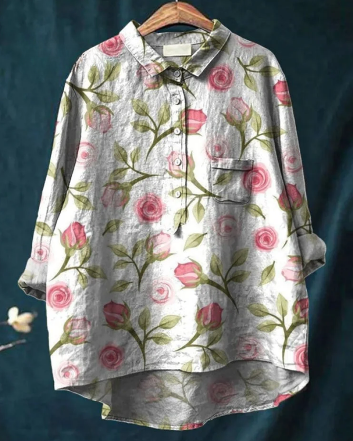 Frontendbild av en kvinnors blommig skjorta, tidlös buttondown-stil som är elegant och mångsidig