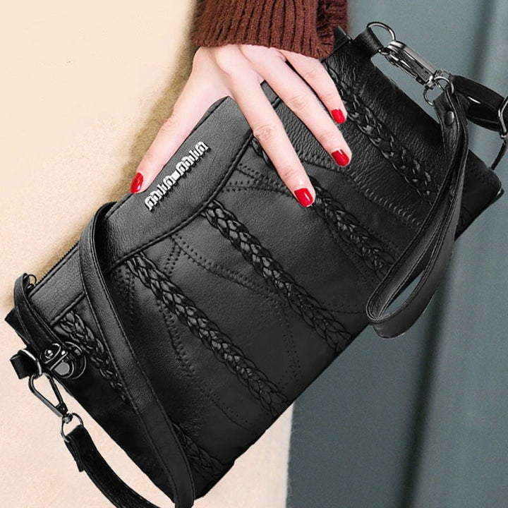 Kvinnors eleganta PU-läder crossbodyväska i clutch-stil. Snygg axelväska som modeaccessoar.