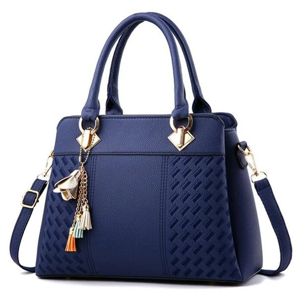 Elegant crossbodyväska i svart PU-läder med tofsar och broderad design för kvinnor.